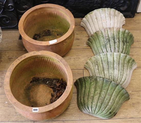 A pair of terracotta pots and four wall planters, W.40cm
